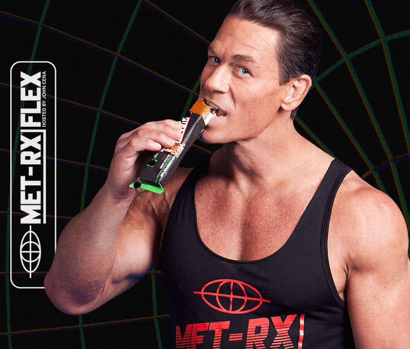 John Cena biting MetRx bar